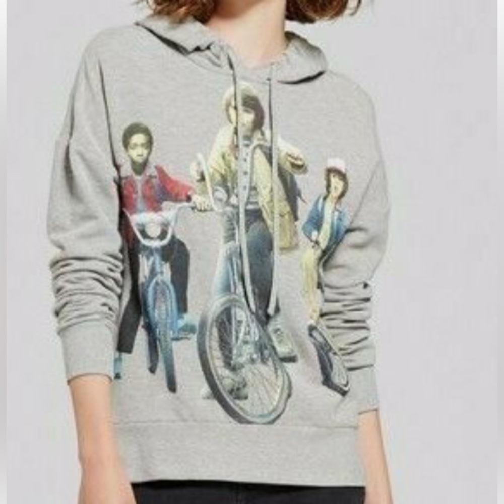 Stranger Things Netflix Lucas, Mike, and Dustin on Bikes Hoodie Gray. Medium.